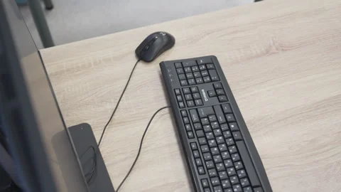 Desktop computer with keyboard rest on organized office desk Stock Footage 306416561