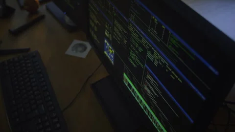 Desktop Computer Screen Running Virus Code in Hacker Workspace Stock Footage 328512862