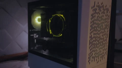 Desktop computer startup with internal lights turning on Stock Footage 327272183