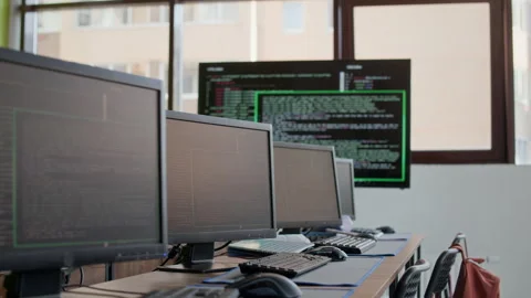 Desktop Computers with Coded Data on screens Standing in Row on Desks Stock Footage 316477357