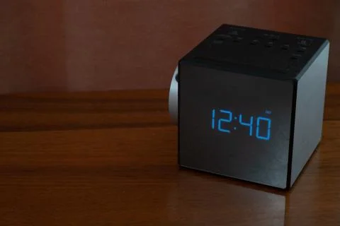 Desktop electronic clock in a dark room Stock Photos