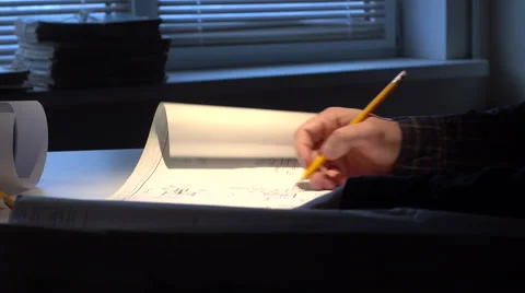 Desktop engineer with drawings. Stock Footage 58816915