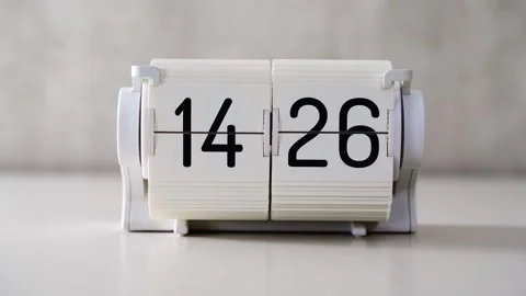 The desktop flip clock has progressed to displaying 2026. Stock Footage 331806796