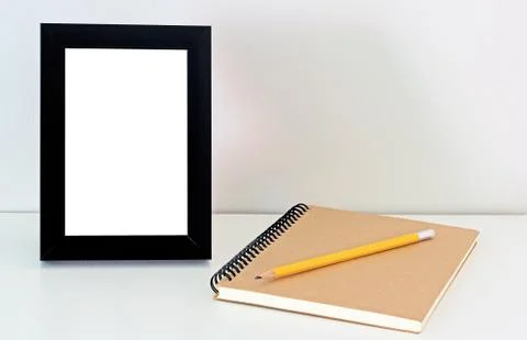 Desktop Frame and Notebook Stock Photos
