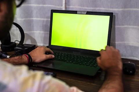 Desktop with gadgets like a mouse external HDDs, headsets, a cell phone and a Stock Photos