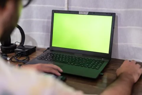 Desktop with gadgets like a mouse external HDDs, headsets, a cell phone and a Stock Photos