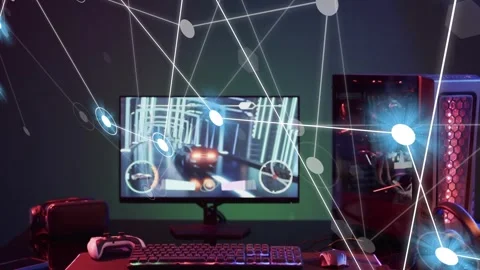 Desktop gaming setup centered, glowing nodes emerging from left forming overlay Stock Footage 335465643
