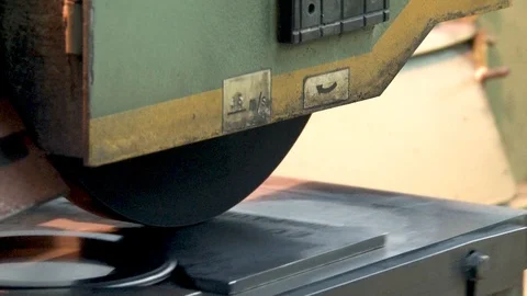 Desktop of grinding machine with details movesunder grinding wheel Stock Footage 110869404