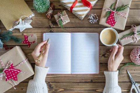 Desktop mock up planner. Flat lay of Woman s hands writes in a notebook and Stock Photos