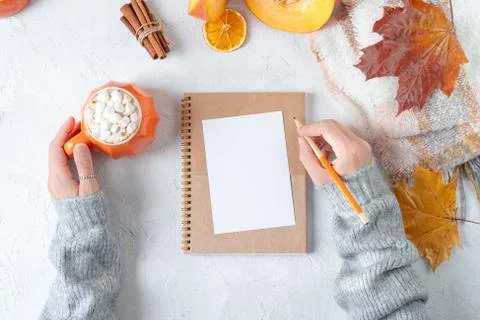 Desktop mock up planner. Top view composition with woman's hands in sweater,  Stock Photos