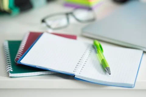 On the desktop is a notebook and pen 写真素材
