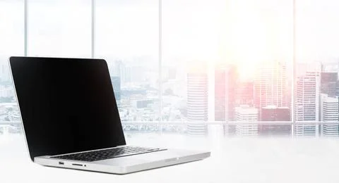 Desktop with panoramic view Laptop on table in office with panoramic view ... Stock Photos