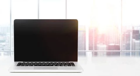 Desktop with panoramic view Laptop on table in office with panoramic view ... Stock Photos