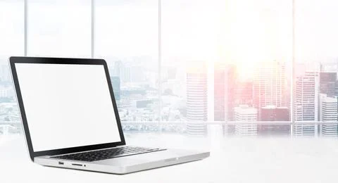 Desktop with panoramic view Laptop on table in office with panoramic view ... Stock Photos