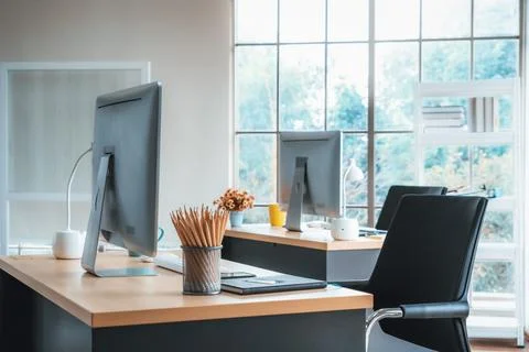 Desktop PC computers in small modern office or home office. Jivy Stock Photos