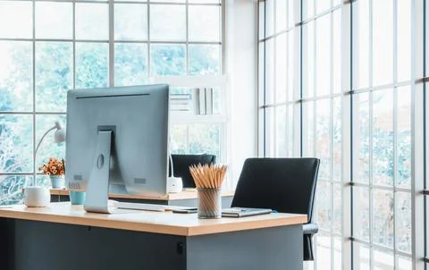 Desktop PC computers in small modern office or home office. Jivy Stock Photos