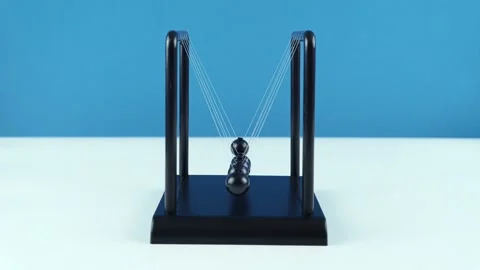 Desktop Pendulum Small Newton Balls On A Blue Background. Stock Footage 162255011