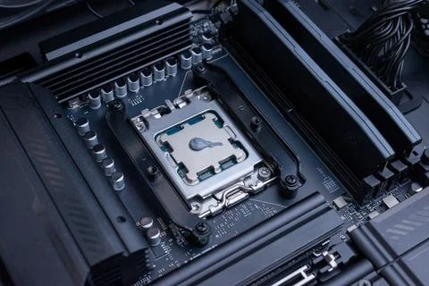 Desktop processor with applied thermal paste installed on motherboard socke.. Stockfoto's