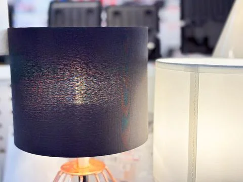 Desktop Table Lamp with Elegant Navy Blue Fabric Drum Shade and Copper Wire Base Foto stock