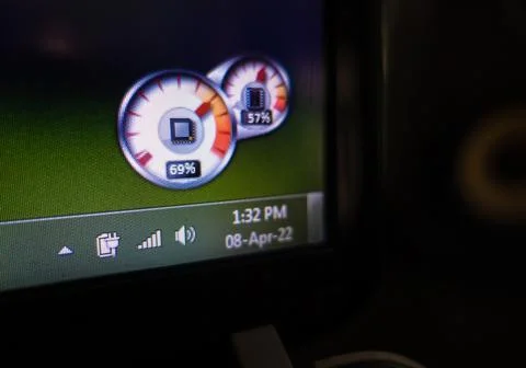 Desktop task bar showing time, date and battery with CPU and ram usage detail Stock Photos