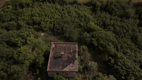 Desolate Cinematic Aerial of Abandoned Building Near Old Train Tracks Stock Footage 335486570