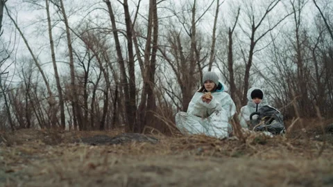 Desolate cold landscape as scientist and child search supplies. Bleak icy Video stock 342744451