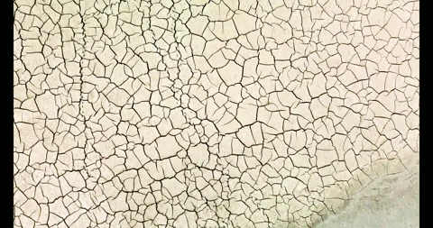 Desolate desiccation: aerial view of drought-stricken landscape Stock Footage 273233442
