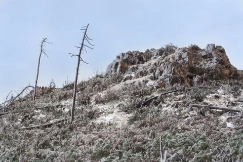 Desolate dramatic landscape: a hill  covered with ice Stock Photos