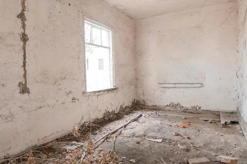Desolate Empty Room Featuring Peeling Paint Broken Window Frame Scattered Tra Stock Photos