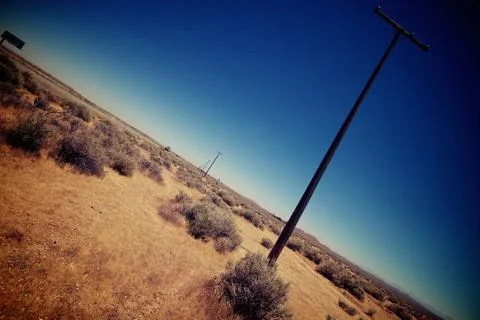 Desolate Landscape with Power Poles Stock Photos