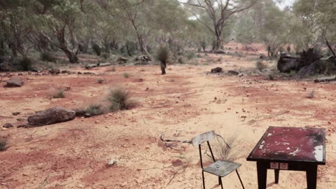 Desolate Landscape With a Solitary Table and Chair Under the Vast Sky Video stock 347117148