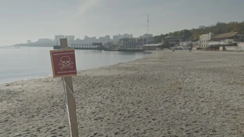 Desolate mined beach with the hazard sign Stock Footage 242491093