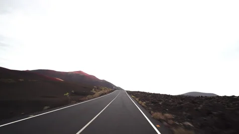 Desolate volcanic plain under cloudy sky Stock Footage 318799835