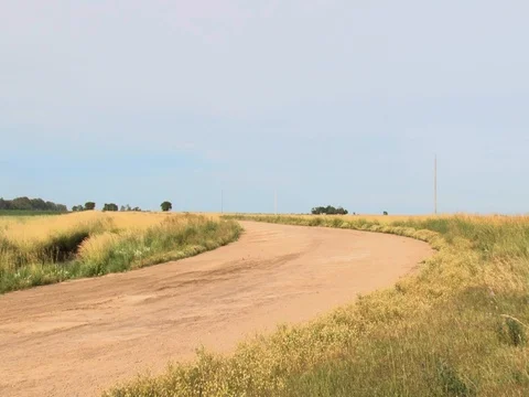 Desolated dirt road turn Stockbeeldmateriaal 128552186