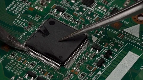 Desolder of surface-mounted electronic chip microprocessor using the soldering Stock Footage 92438215