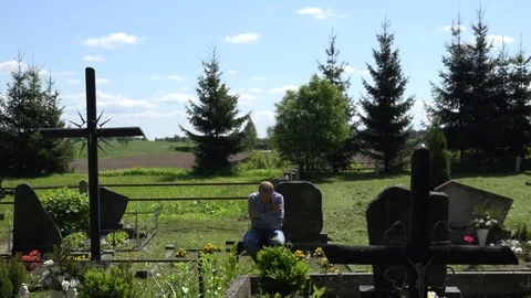 Despair mourning son man sit on bench ne... | Stock Video | Pond5