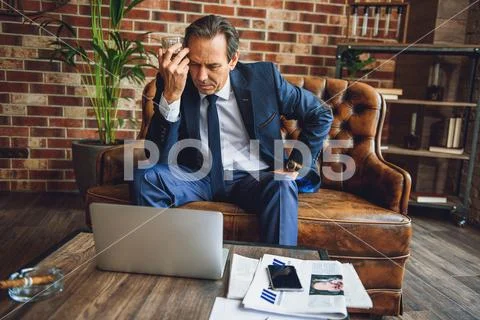 Despaired mature man tensely thinking Stock Photos
