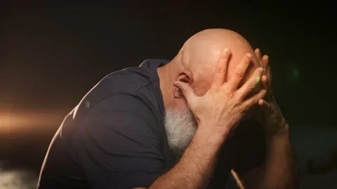 Desperate bearded man in his 50s cries deeply, struggling with trauma Stock Footage 346714287