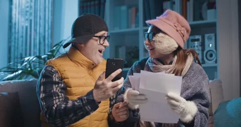 Desperate couple checking bills at home Stock Footage 297790201