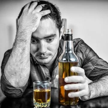 Desperate drunk hispanic man drinking Stock Photos