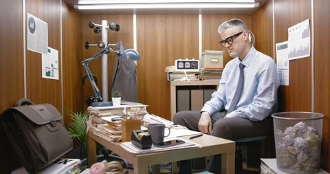 Desperate employee sitting at his desk and crying Stock Footage 309020439