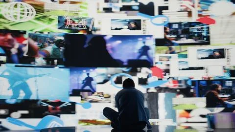 Desperate guy staring at phone screen in misery symbolizing toxic social media 写真素材