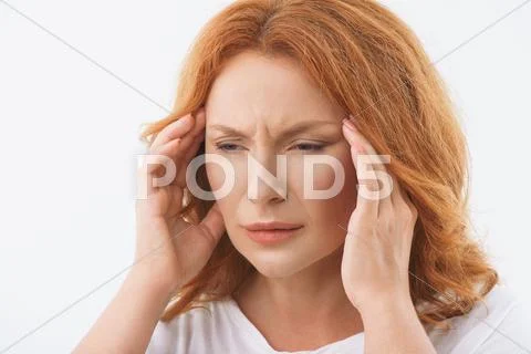 Desperate lady feels pain in head Stock Photos