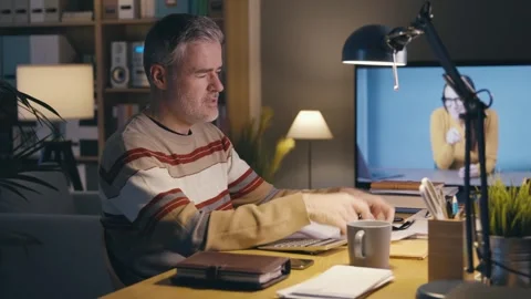 Desperate man checking bills and expenses Stock Footage 306126462