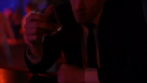 Desperate man drinking too much alcohol in bar alone, problems in private life Stock Footage 89836433