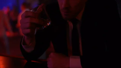 Desperate man drinking too much alcohol in bar alone, problems in private life Stock Footage 89840685