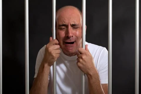 Desperate man in jail Stock Photos