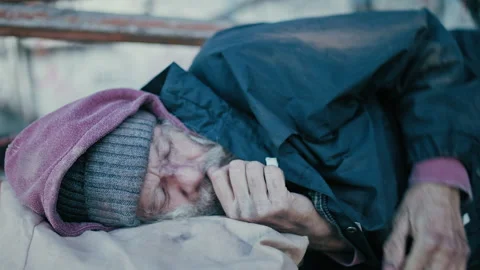 Desperate man in need sleeping outdoors, homeless lifestyle, social problem Stock Footage 165659676