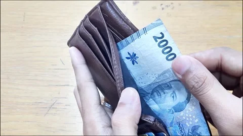 The desperate man opened his empty wallet and found only two thousand rupiah. Stock Footage 288974637