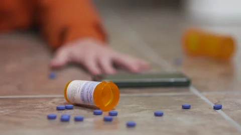 Desperate Man Reaching for Phone After Pill Overdose Video stock 56597902